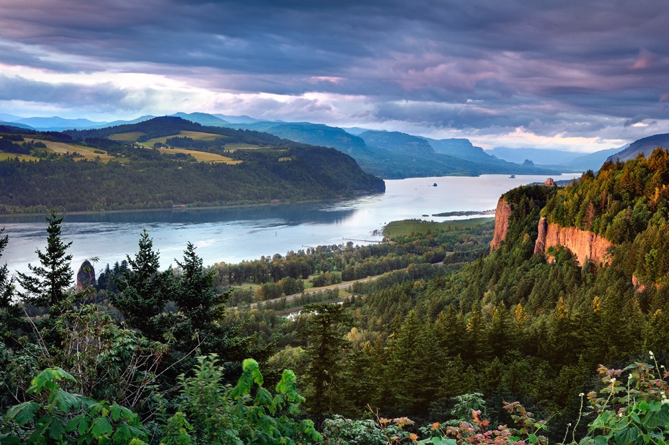 The Columbia River winding through the Gorge beneath a dramatic sky